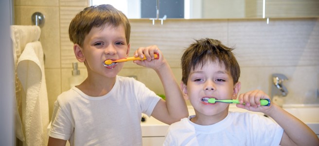 Brushing Our Teeth While Mom Watches Us
