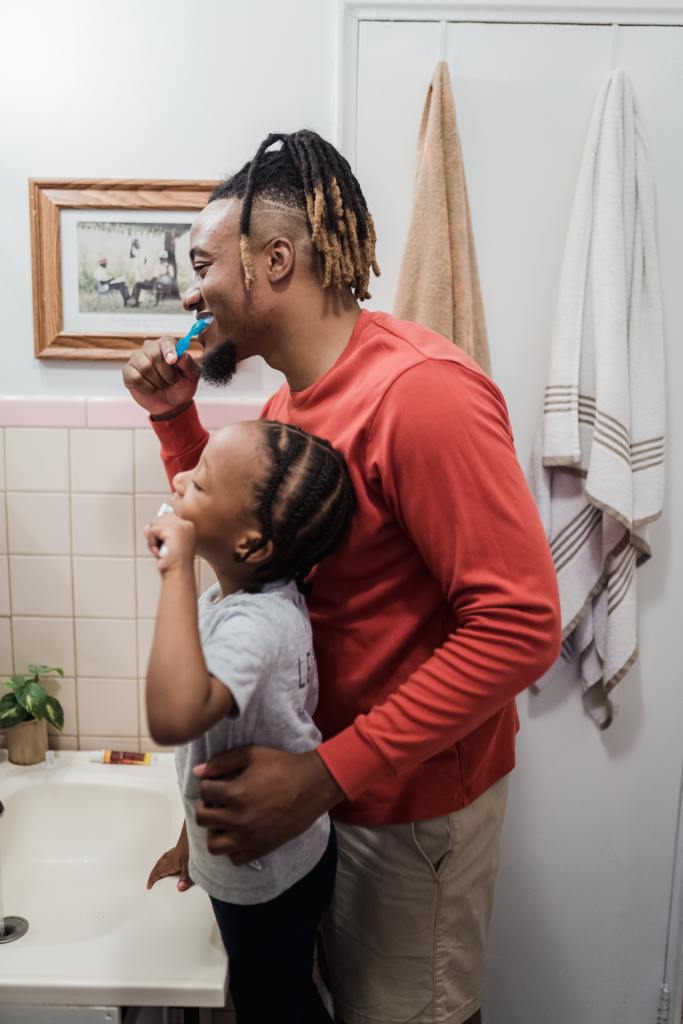 Laughing And Smiling Brushing Teeth with Daddy