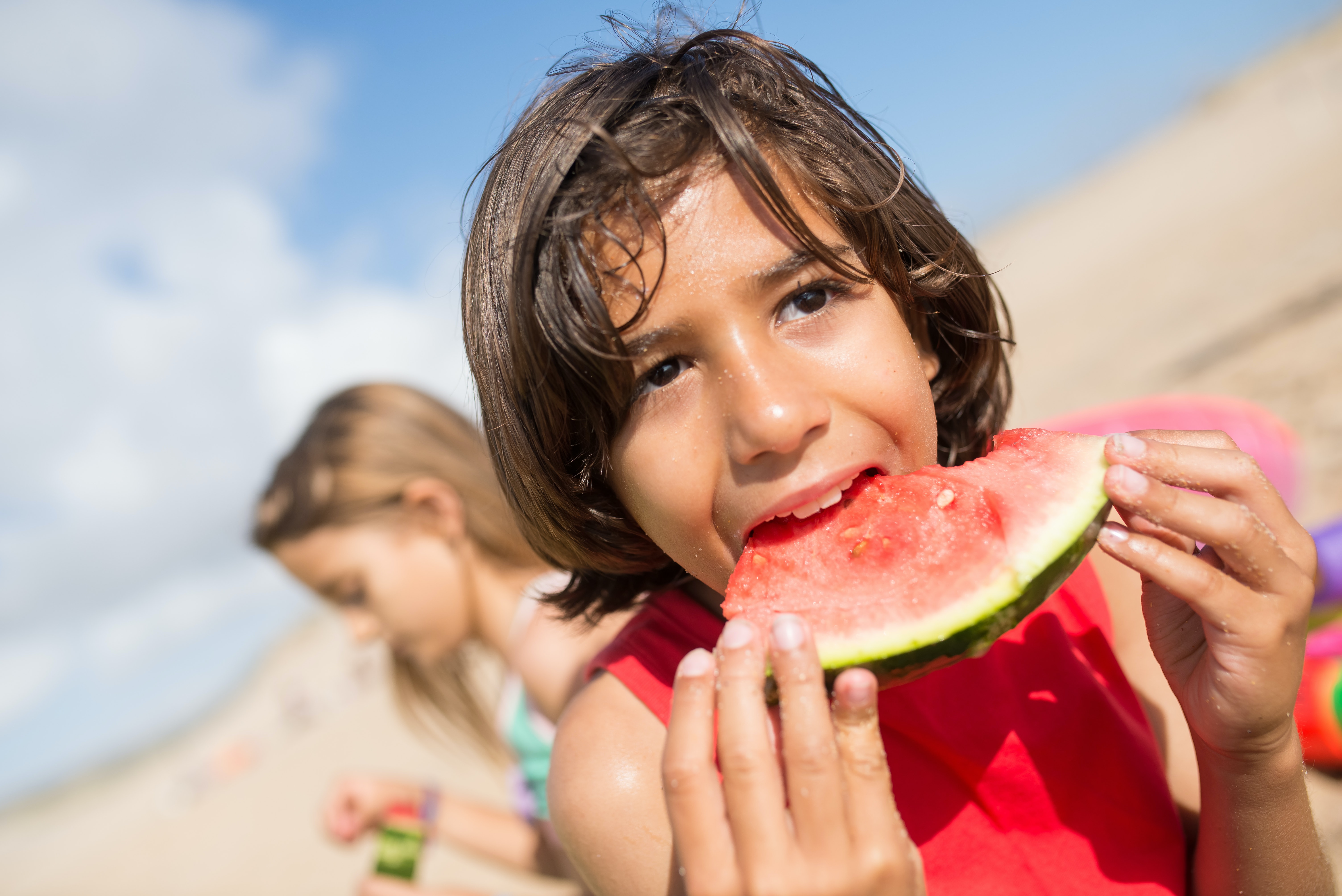 Cooling Off Eating Watermelon At The Beach