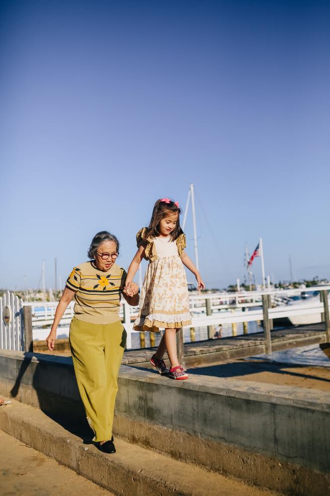 Grandma And Me Taking A Walk By The Pier